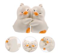 1 paio di fermalibri a forma di anatra di cartone animato. Anatra carina che