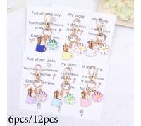 6pcs/12pcs Set elegante e alla moda di portapenne e portachiavi con design a margherita, sacchetto regalo abbraccio da tasca, gettone abbraccio da tasca. Adatto per feste di compleanno, regali di rito
