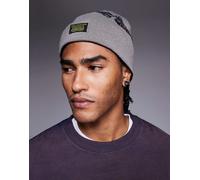 ASOS DESIGN - Berretto in maglia double-face grigio e nero con grafica di teschio-Verde No Size