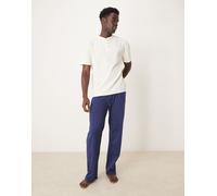 ASOS DESIGN - Pigiama blu navy e bianco lavorato a nido d'ape con scollo serafino L