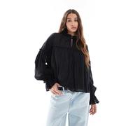 ASOS DESIGN - Top a maniche lunghe stile grembiule nero stropicciato allacciato sul collo e con volant 42