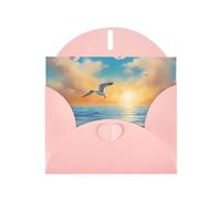 Biglietto di auguri orizzontale con gabbiani vicino al mare, con busta a forma di cuore rosa e per scrivere vari auguri di festa