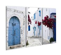 bilderfelix Quadro su tela Porte blu, finestre, muro bianco, edificio Sidi Bou Said, Tunisia - Tela 130x80 cm - 3 pannelli