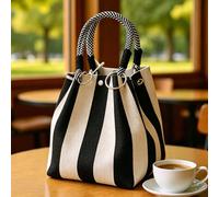 Borsa a secchiello mini in tela a righe bianche e nere con anello metallico a O e manico superiore con nodo a quadri, una borsa da vacanza, un must-have per donne alla moda, studentesse e persone del 