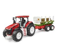 Trattore ROADMAX con rimorchio e tronchi