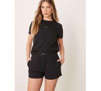 Calvin Klein Jeans - Pantaloncini taglio corto in jersey neri con logo-Nero L