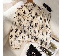 Camicia a maniche lunghe per ragazze pre-adolescenti con colletto arricciato, maniche a sbuffo e tessuto con texture floreale in albicocca con stampa floreale nera. Il design con bottoni la rende adat