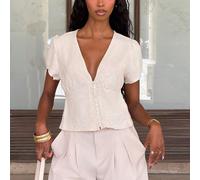 Camicia elegante estiva in lino con scollo a V profondo, manica corta, con design a bottoni in perla, che affina e valorizza la vita. Camicia da donna alla moda e casual. Camicetta con scollo a V prof