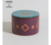 Candela in terracotta arancione, viola e blu, alla fragranza di fico