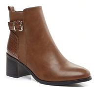 Cette botte de cheville ornée d'une boucle dorée Cette botte de cheville ornée d'une boucle dorée, allie élégance et modernité. Il tessuto consente una polivalenza nei colori, mentre la boccia aggiung