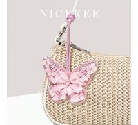 Ciondolo da borsa minimalista e alla moda per vacanze, pendente in finta noce di cocco con perline a contrasto di colore, design mini raffinato, altamente attraente, compatto e chic, versatile per uso
