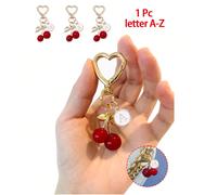 Ciondolo di alta qualità alla moda e carino a forma di farfalla dorata con ciliegie - Portachiavi con ciliegie, accessorio stile per zaino, ciondolo, portachiavi, ciondolo in lega con lettere da A a Z