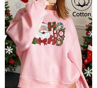 Collezione natalizia: felpa con cappuccio casual da donna con spalle scese, foderata in pile e stampata. La parte anteriore presenta un festoso motivo natalizio con un Babbo Natale sorridente che indo