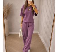 Completo da casa da donna dalla vestibilità comoda: top a maniche corte e pantaloni a gamba larga per un comfort quotidiano senza sforzo, uno stile casual cittadino e un abbigliamento elegante per la 