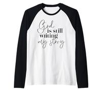 Dio sta ancora scrivendo la mia storia Fede cristiana religiosa Maglia con Maniche Raglan
