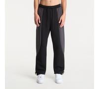 Pantaloni in fleece a blocchi di colore con orlo aperto Nike Tech - Uomo - Nero M