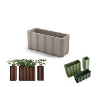 Fioriera NEBULA in Polietilene è un set di vasi con curve sinuoso e forma ondulata Dimensioni 89x35xh 40 cm Colore Ambra ambra