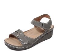 Générique Sandali eleganti da donna per un rilassamento casual. Design a punta aperta, tacco a zeppa, cinturino regolabile, perfetto per l'estate e da abbinare ai jeans.