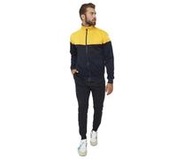 Giacca con zip, inserti in tessuto e tasche laterali; pantaloni con loghi ricamati, tasche laterali e polsino sul fondo.