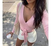 Giacca da yoga e fitness rosa, maglietta corta a v morbida ed elastica con maniche lunghe, design semplice e casual elegante, capo essenziale versatile per il guardaroba delle donne, adatto per la pri