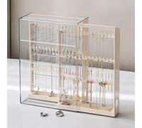 Gioielli che mostrano una torre di gioielli a portabia per le collane dei