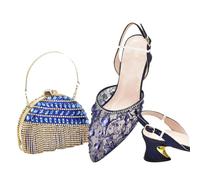 I classici italiani di colore rosso progettano le scarpe e la borsa delle donne africane insieme con il cristallo brillante per la festa nuziale delle donne