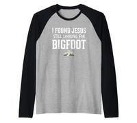 I Found Jesus Still Looking for Bigfoot Funny Christian Maglia con Maniche Raglan