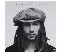 raised under grey skies