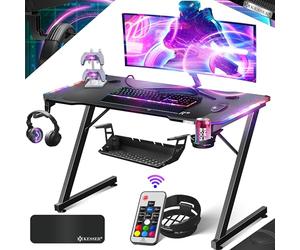KESSER® Scrivania da Gioco LED - 120 x 60 cm, forma di Z, Gancio per Cuffie e Rivestimento in Carbonio, Ergonomica per PC, con Portabicchieri, Nero Carbon