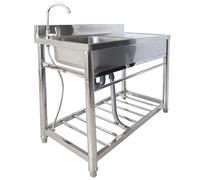 Lavello della cucina, singolo lavandino dell'acciaio inossidabile della ciotola con il piano di lavoro e gli scaffali, lavandino di catering per il ristorante