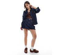 Levi's - Minigonna in denim a pieghe blu lavaggio scuro-Blu navy W26