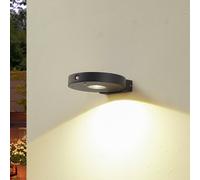 Lucande applique a LED solare Tavon, rotonda, nera, sensore LUCANDE