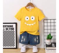 Maglietta a maniche corte con stampa di un volto sorridente, adatta per ragazzi dai 4 ai 7 anni durante l'estate calda. Tessuto morbido e confortevole, colori vivaci, motivo a cartone animato che aggi