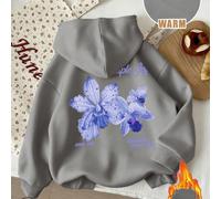 Maglione imbottito con cappuccio morbido e selvaggio. Questo maglione imbottito ha una base di colore nero assoluto, con una stampa di orchidee rosa sul retro, super assoluta. "Libera la bestia dentro