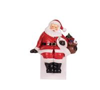 Natale Casa: Statua di Babbo Natale seduto e riposante che tiene una mano. Statuina in resina. Scultura da mensola.