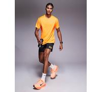 NIKE Pantaloni sportivi 'CITY MRTH STRIDE' giallo scuro / rosso / nero Uomo NIKE M giallo scuro / rosso / nero