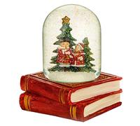 Palla Di Vetro Natalizia Con Cantanti Di Canti E Base A Mucchio Di Libri