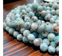 Perline Larimar della Repubblica Dominicana con inclusione di ossido di ferro nero (queste ematite inclusione manifesta come strisce nere che forniscono un contrasto sorprendente) cristallo energetico