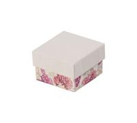 Piccolo portagioie con fiori bianchi, ideale come regalo.