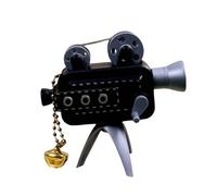 Portachiavi miniatura tenuto in mano dei proiettori cinematografici retrò offrendo 24 immagini dell'esposizione e della costruzione dell'ABS