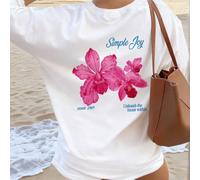 Questa colorata maglietta da donna con stampa floreale e a lettere dal collo rotondo è alla moda e versatile. T-shirt grafica, top bianco, top rosa, adatta per l'abbigliamento da vacanza. Casual estiv