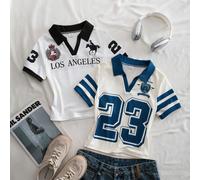 Queste sono magliette a maniche corte reversibili a due colori adatte per ragazze di età compresa tra 8 e 12 anni. Presentano una silhouette aderente con un design a blocchi di colore e un colletto se