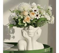 Questo design presenta una forma di vaso elegante, che raffigura la posa di una donna con le mani che coprono il viso. Il design è minimalista ma alla moda, con la forma unica delle mani che coprono i