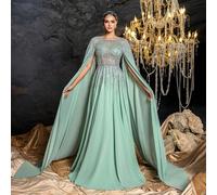 Questo elegante abito da sera lungo per donna presenta un dettaglio sulla spalla simile a uno scialle, con decorazioni in perle sfumate e ricami in paillettes. La silhouette aderente e la gonna fluent