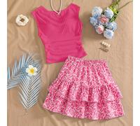Questo nuovo completo da 2 pezzi per ragazze adolescenti presenta un gilet casual e comodo in maglia jacquard rosa chiaro con collo tondo abbinato a una gonna a due balze coordinata. La vita e l'orlo