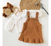 Questo set da 2 pezzi per bambine presenta una maglietta in velluto a coste con colletto Peter Pan e maniche a lanterna, e un vestito in velluto a coste marrone con tasche, spalline arricciate e botto