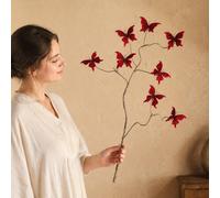 Ramo con farfalle artificiali dai colori vivaci, ideale come centrotavola