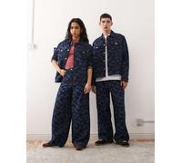 Reclaimed Vintage x Stranger Things - Jeans unisex larghi blu medio con logo stampato a laser W38