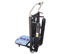 Scalatore delle scale cingolate. Scalatore per scale da 200-400 kg con batteria. Macchina per la movimentazione dei carichi per carichi pesanti. Carrello cingolato, carrello a mano