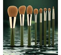 Set di 8 pennelli for il trucco con setole morbide e scintillanti verdi. Strumento for il trucco.